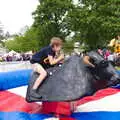 Fred desperately tries to cling on to a rodeo bull, The Diss Carnival 2019, Diss, Norfolk - 9th June 2019