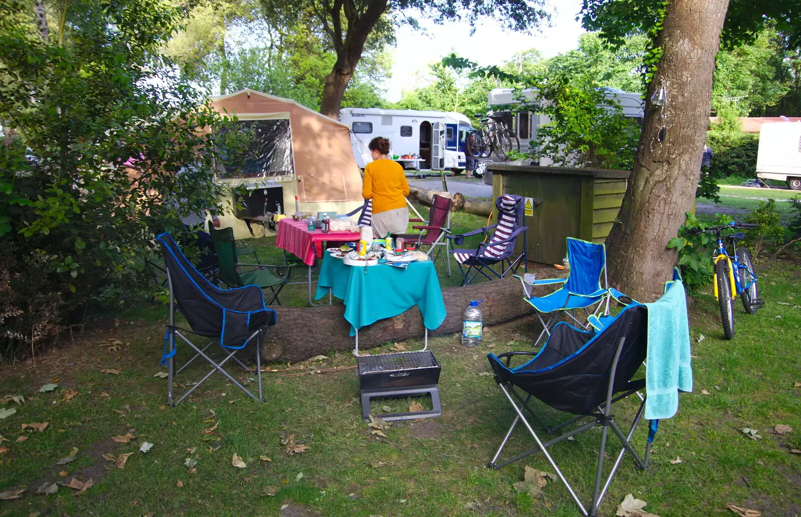 Isobel helps set up the barbeque area, from Cliff House Camping, Dunwich, Suffolk - 15th June 2019