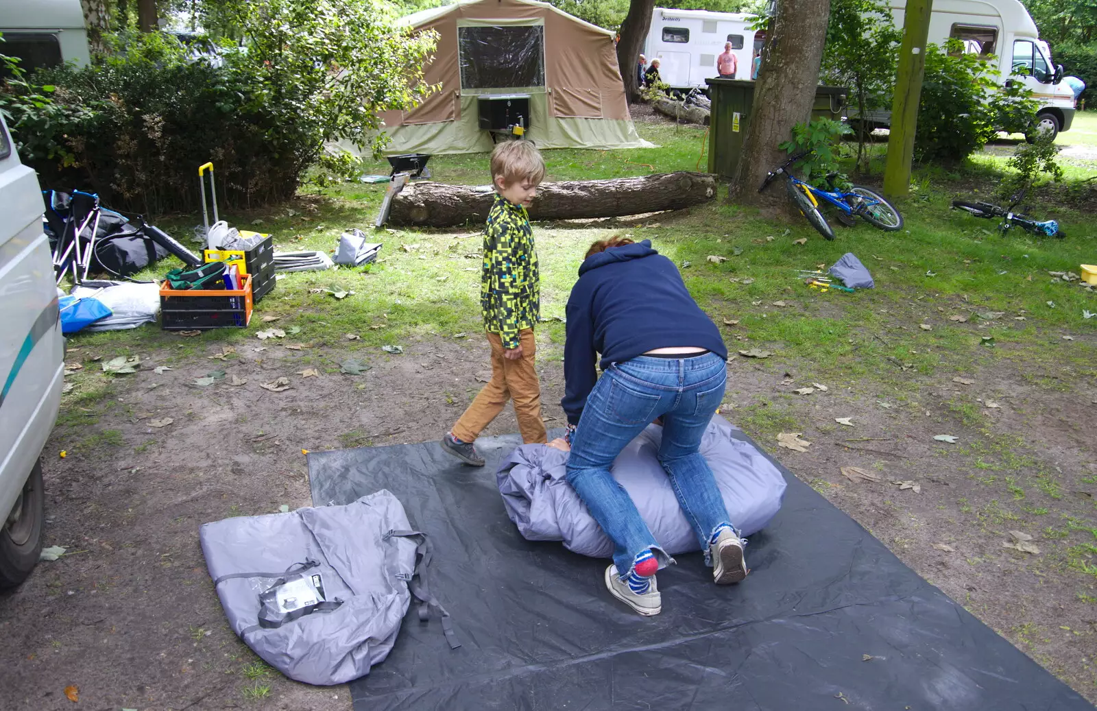 Isobel packs up the awning as Harry looks on, from Cliff House Camping, Dunwich, Suffolk - 15th June 2019