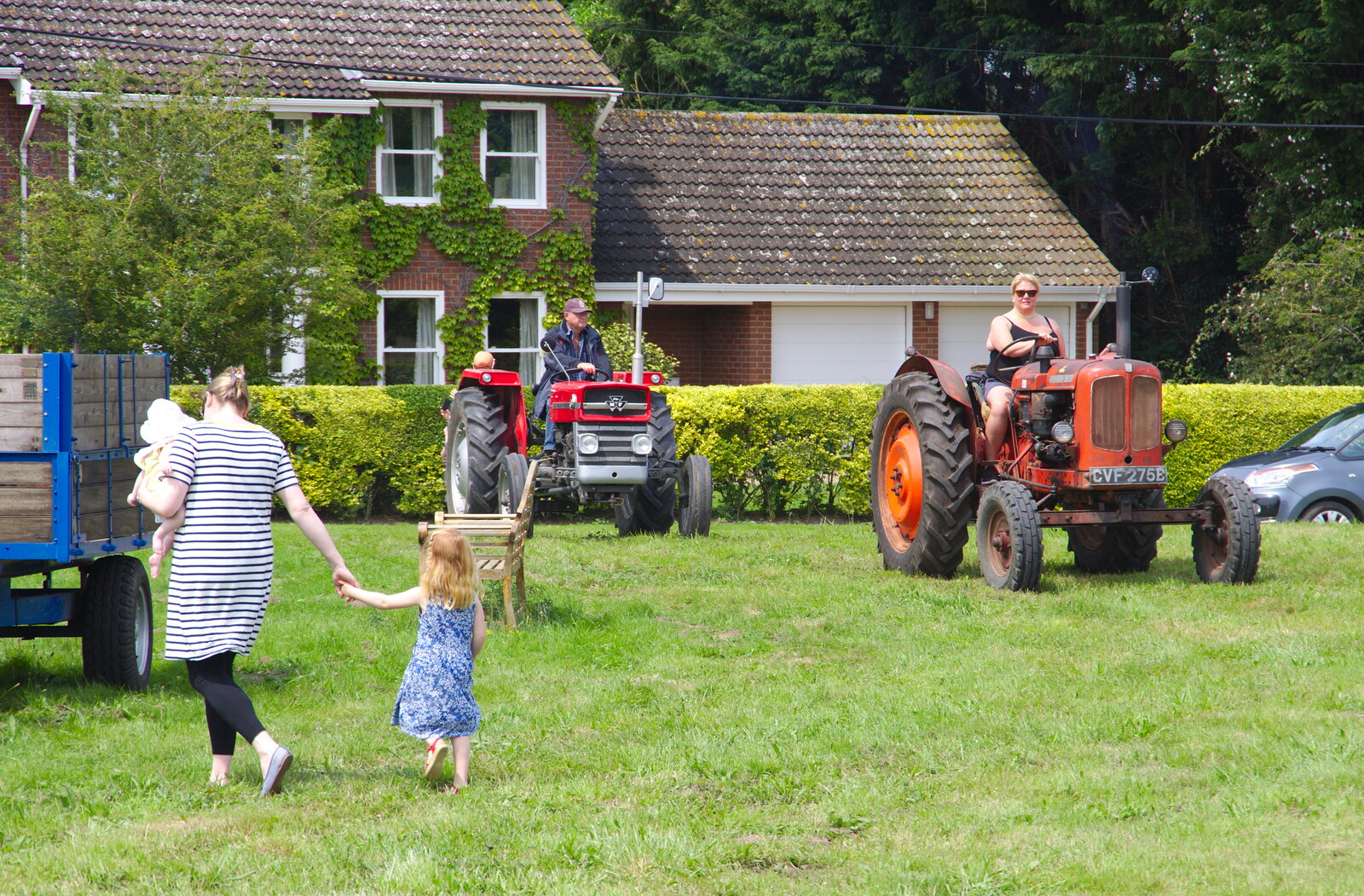 The first of the tractors trundle onto the green from A Hog Roast on Little Green, Thrandeston, Suffolk - 23rd June 2019