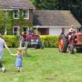 The first of the tractors trundle onto the green, A Hog Roast on Little Green, Thrandeston, Suffolk - 23rd June 2019