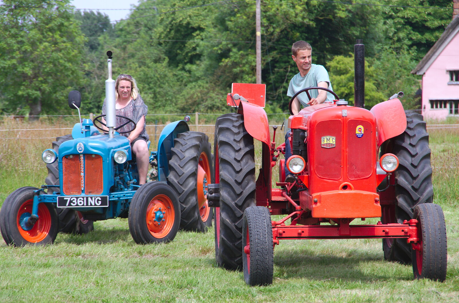 A Fordson Major and a BMC are parked up from A Hog Roast on Little Green, Thrandeston, Suffolk - 23rd June 2019