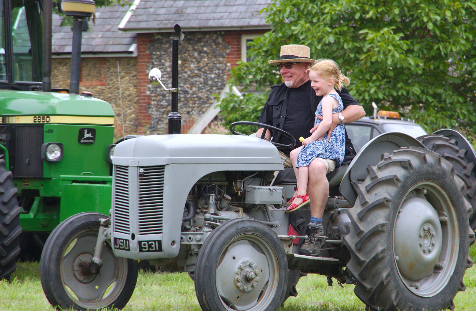 A girl gets a ride on a Little Grey Fergie from A Hog Roast on Little Green, Thrandeston, Suffolk - 23rd June 2019