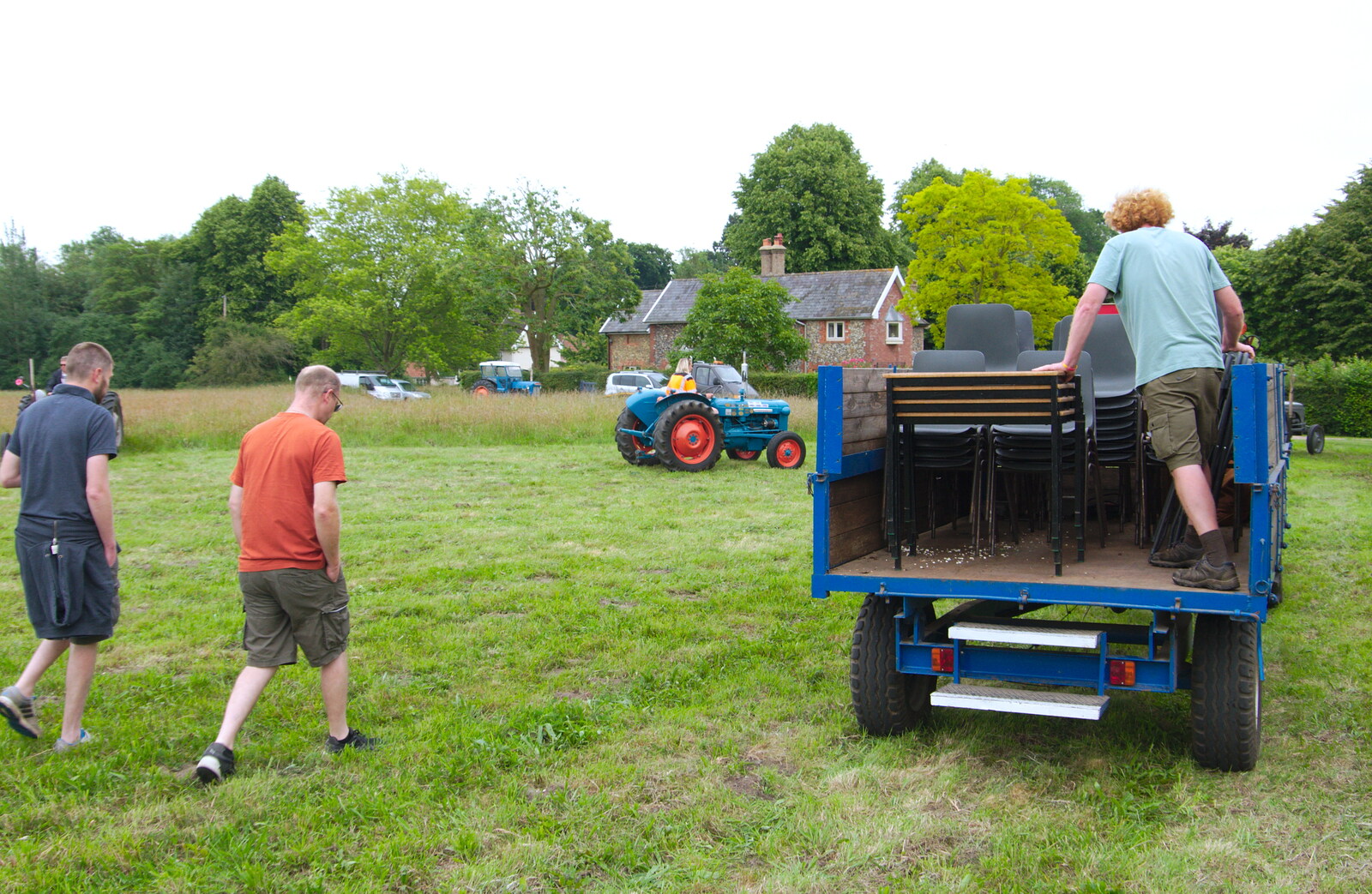 The boys head of to take the tables back to the village hall from A Hog Roast on Little Green, Thrandeston, Suffolk - 23rd June 2019
