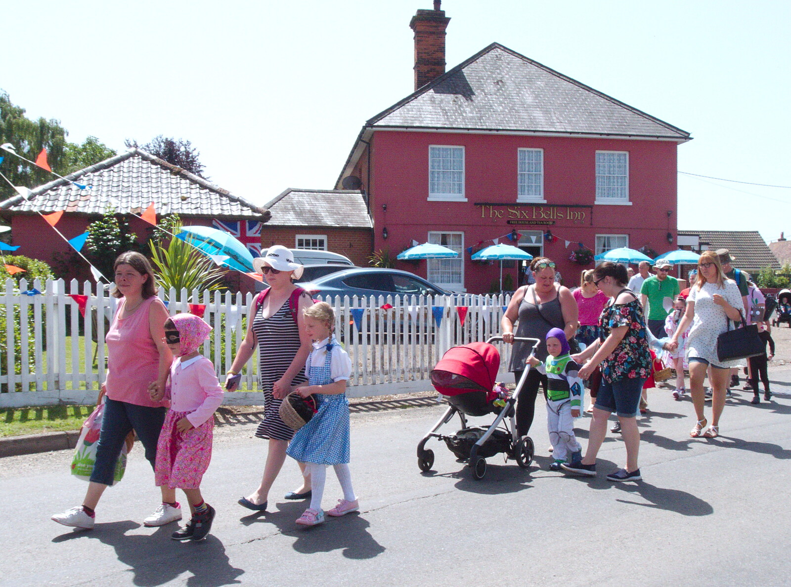 A small crowd follows along from GSB and the Gislingham Fete, Suffolk - 29th June 2019