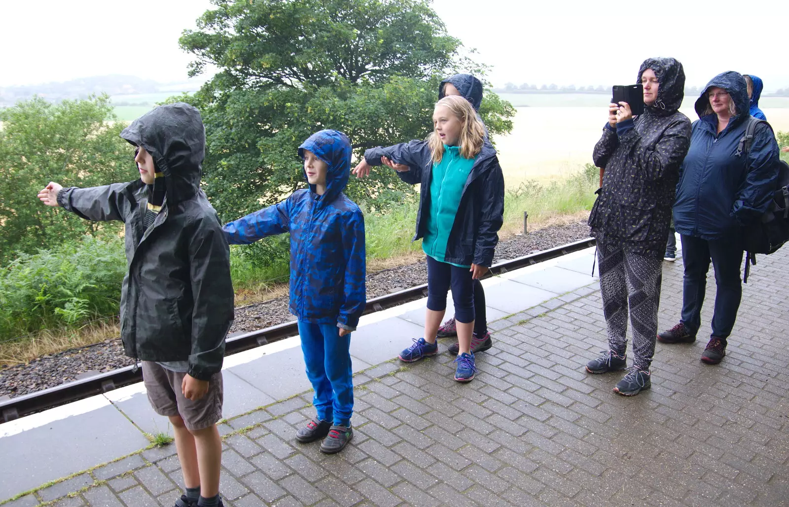 The kids flag down the train, as it's a request stop, from Kelling Camping and the Potty Morris Festival, Sheringham, North Norfolk - 6th July 2019