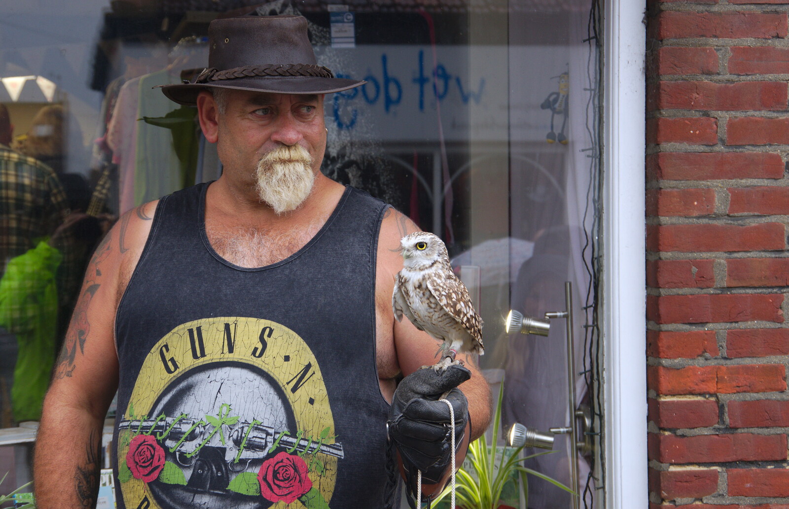 On Fore Street, there's a dude with a small owl from Kelling Camping and the Potty Morris Festival, Sheringham, North Norfolk - 6th July 2019