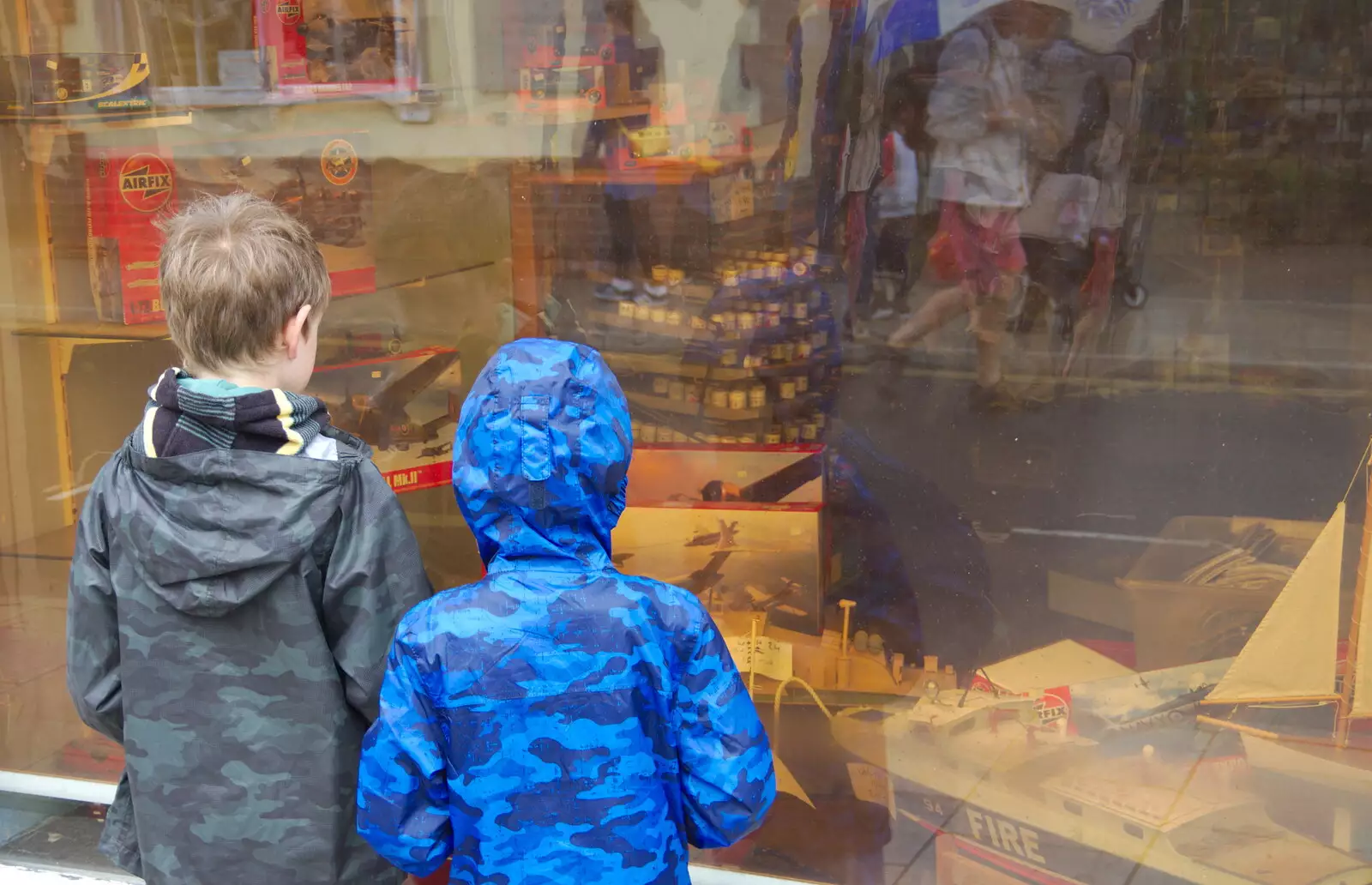 The boys look forlornly at a closed-down model shop, from Kelling Camping and the Potty Morris Festival, Sheringham, North Norfolk - 6th July 2019