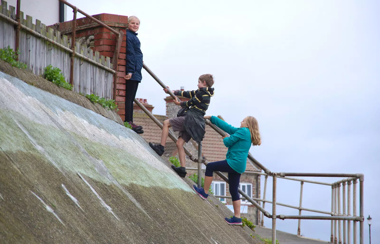 Fred and Alice scale the sea wall, from Kelling Camping and the Potty Morris Festival, Sheringham, North Norfolk - 6th July 2019