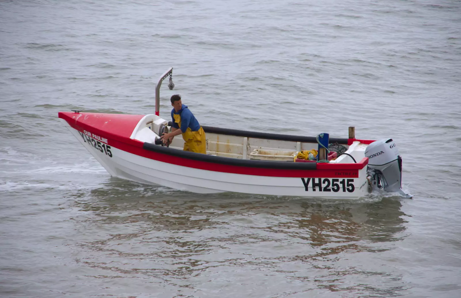 A fisherman brings his boat in, from Kelling Camping and the Potty Morris Festival, Sheringham, North Norfolk - 6th July 2019