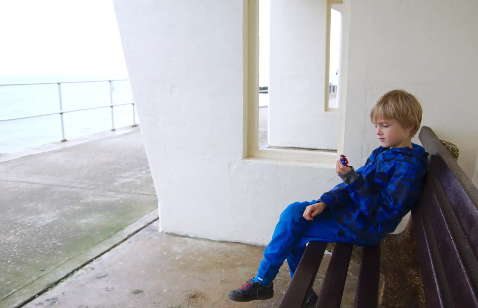 Harry looks at a toy thing, from Kelling Camping and the Potty Morris Festival, Sheringham, North Norfolk - 6th July 2019