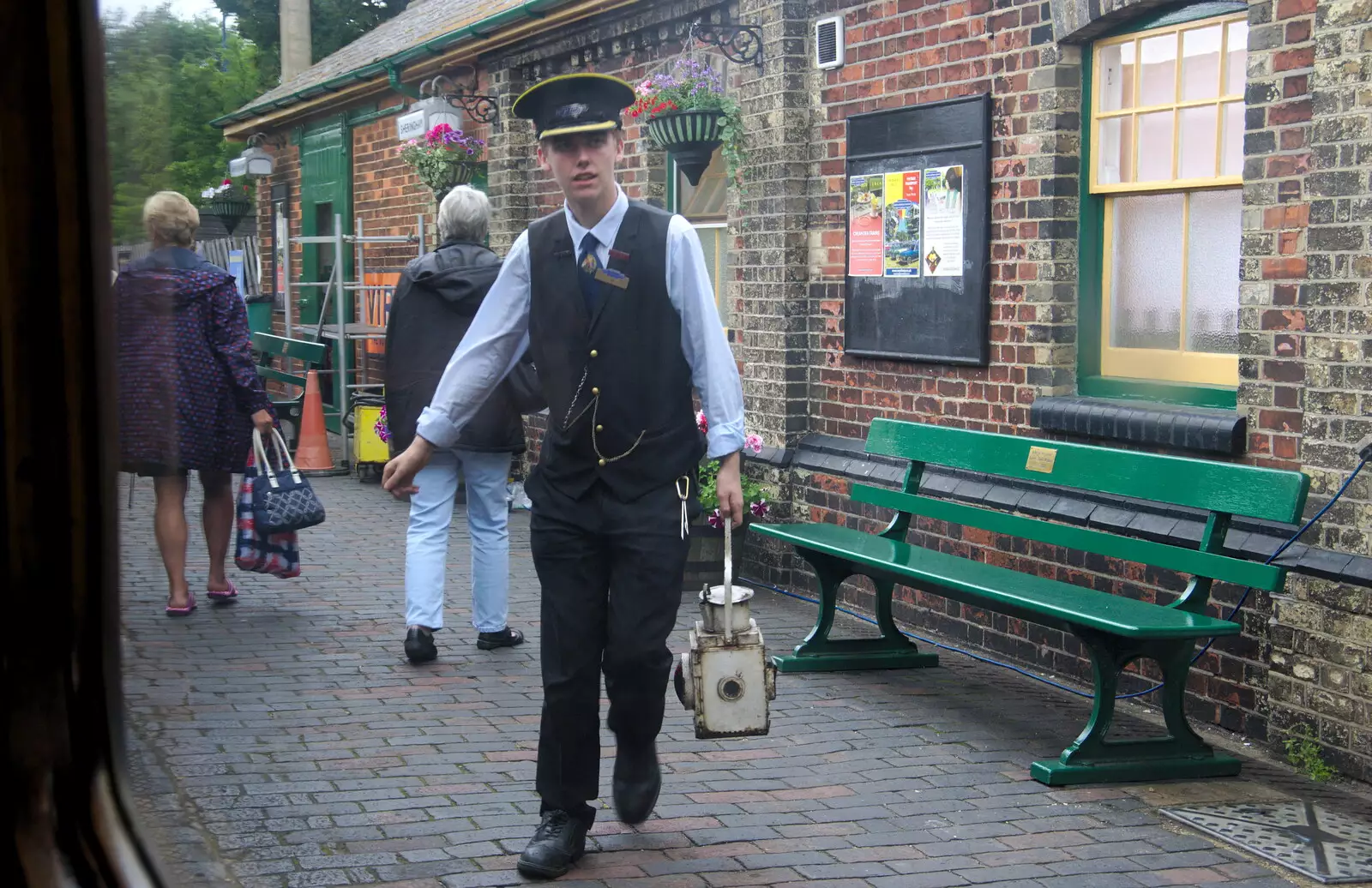 A conductor roams around with a lantern, from Kelling Camping and the Potty Morris Festival, Sheringham, North Norfolk - 6th July 2019