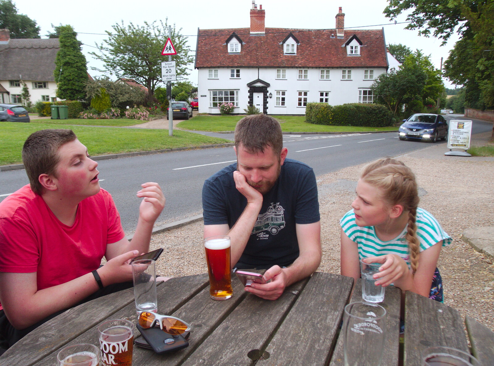 A Postcard from Boxford and BSCC at Pulham, Suffolk and Norfolk - 13th July 2019: The Boy Phil checks his phone outside the Crown