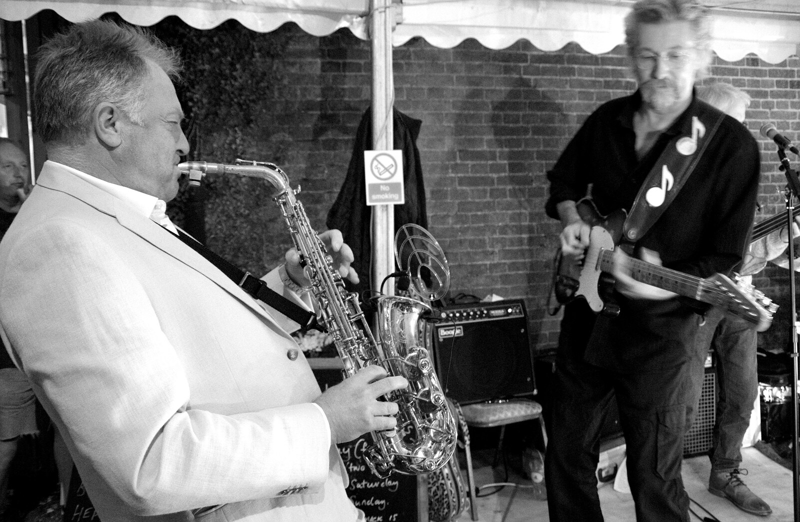 The sax player returns from a tour of the audience from The Shakesbeer Festival, Star Wing Brewery, Redgrave, Suffolk - 13th July 2019
