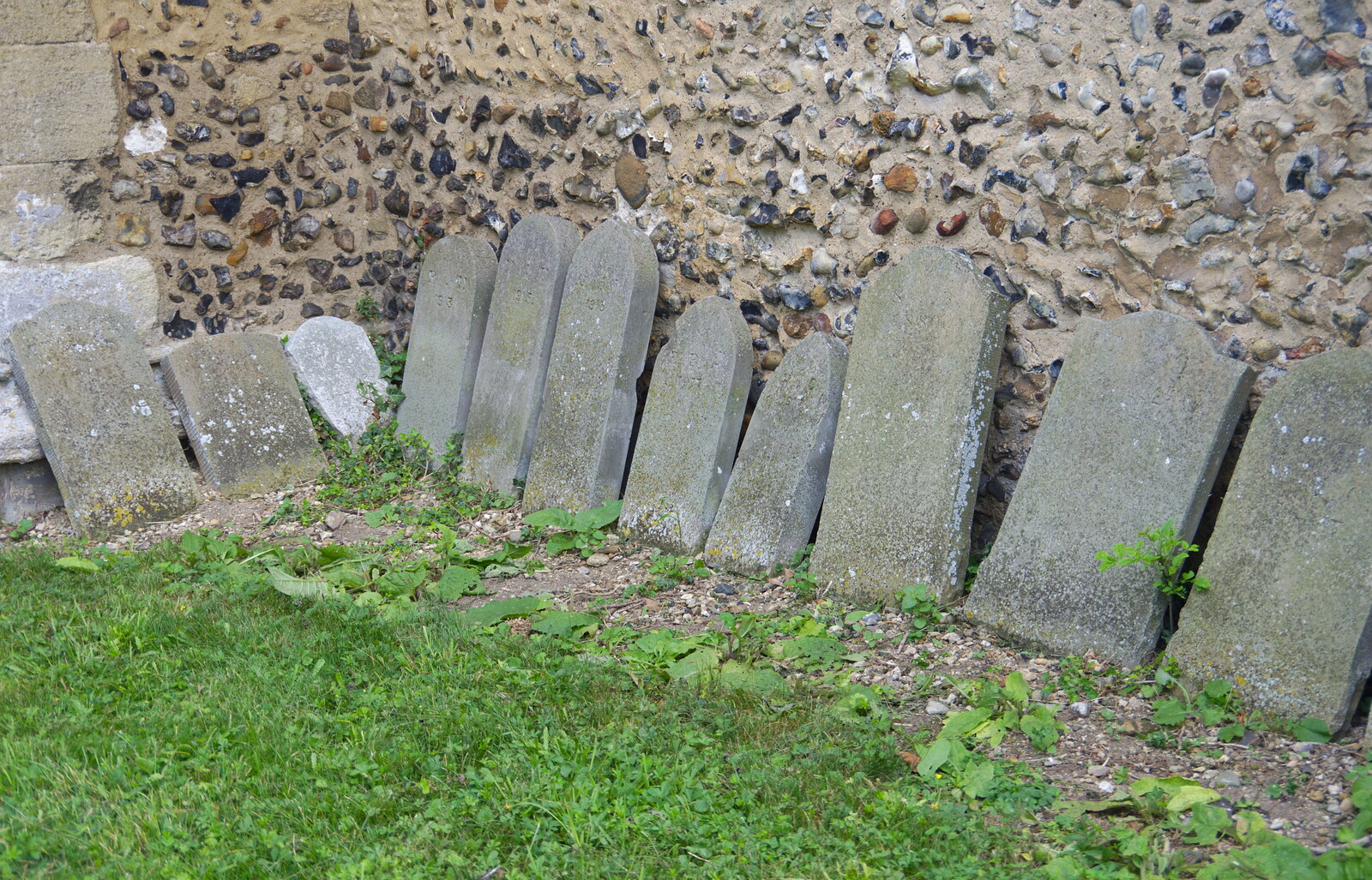 Gravestones lean on the church wall from The Shakesbeer Festival, Star Wing Brewery, Redgrave, Suffolk - 13th July 2019