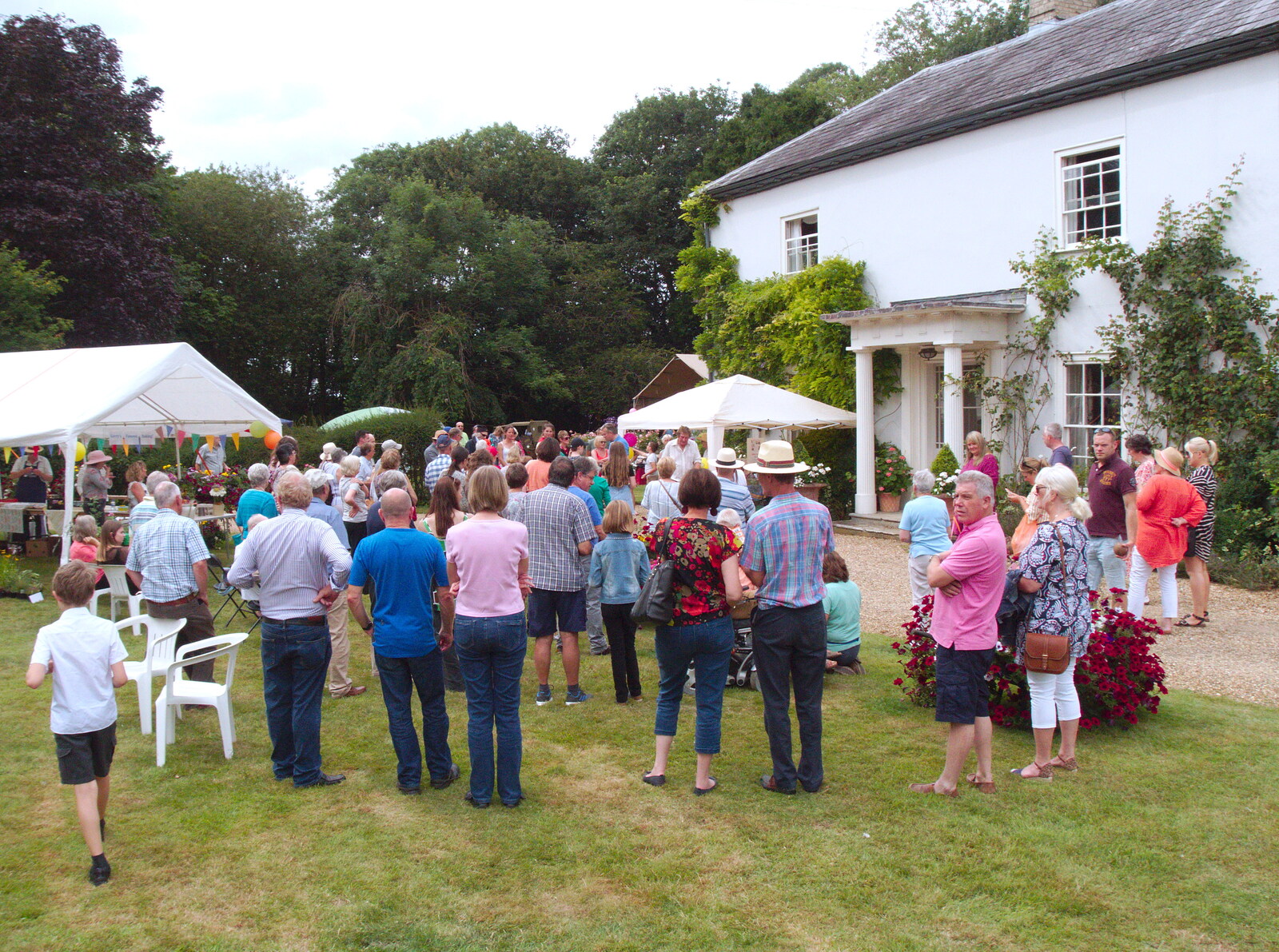 The crowds listen out for the raffle draw from GSB at the Summer Fete, Market Weston, Suffolk - 20th July 2019