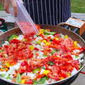 Isobel adds tomatoes to the paella, A Summer Party, Brome, Suffolk - 3rd August 2019