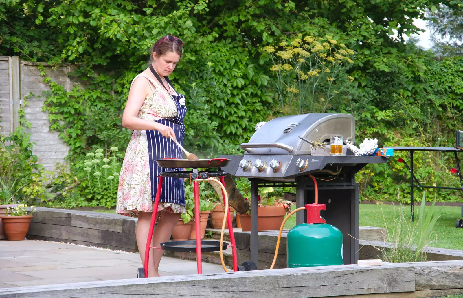 Isobel pokes the paella, from A Summer Party, Brome, Suffolk - 3rd August 2019