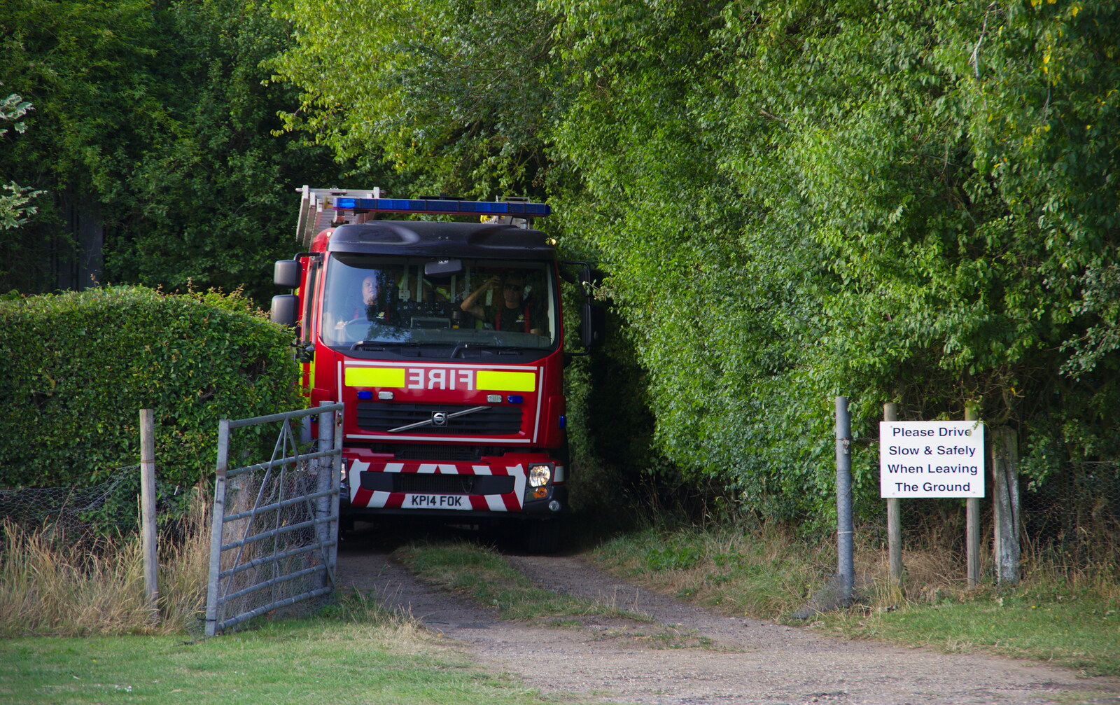 The fire engine squeezes up the lane from A Water Fight with a Fire Engine, Eye Cricket Club, Suffolk - 5th August 2019