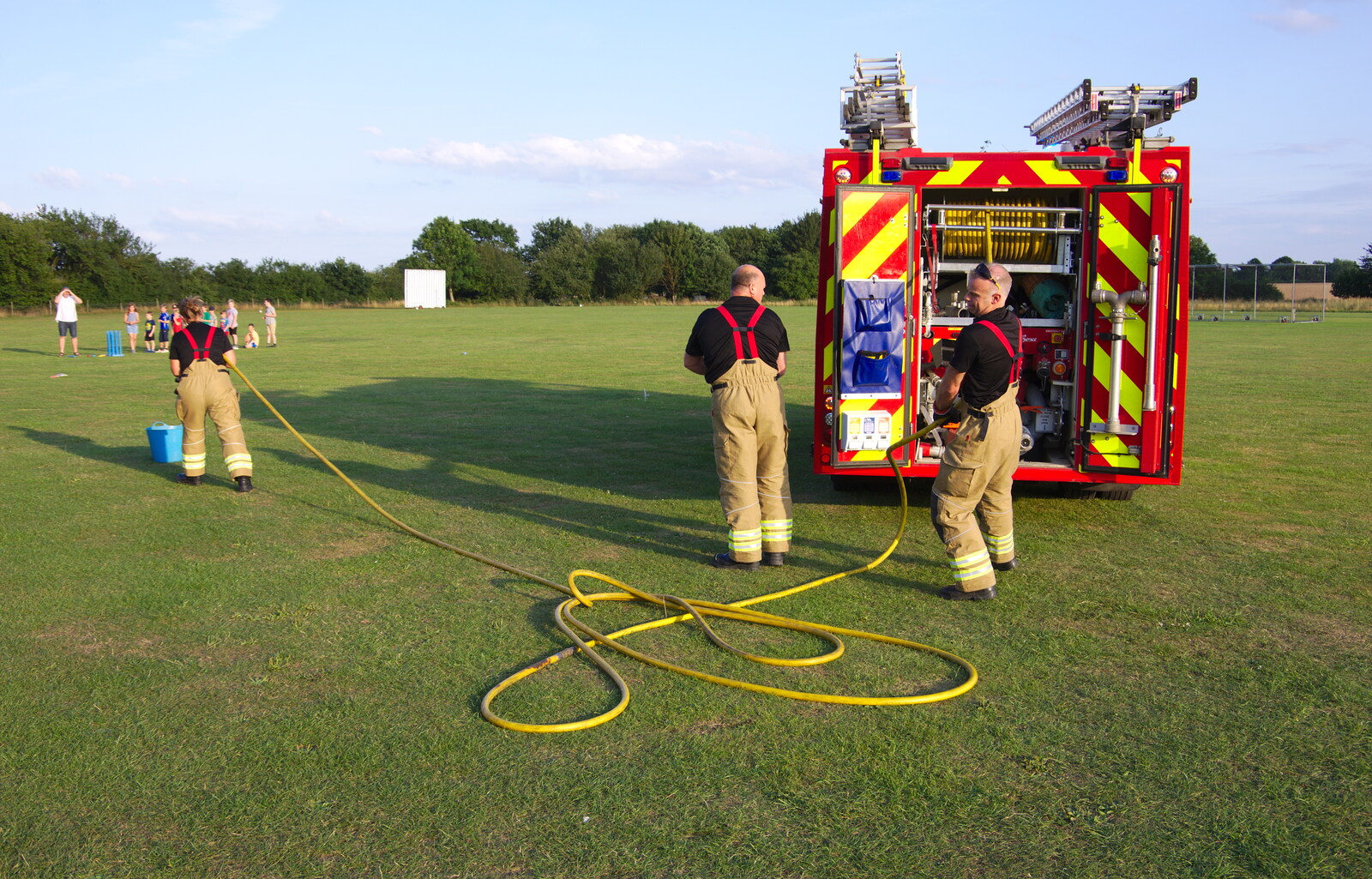 Hoses are unrolled from A Water Fight with a Fire Engine, Eye Cricket Club, Suffolk - 5th August 2019