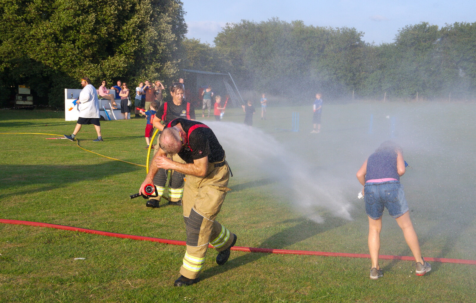 Even the fire-fighters are not immune from A Water Fight with a Fire Engine, Eye Cricket Club, Suffolk - 5th August 2019