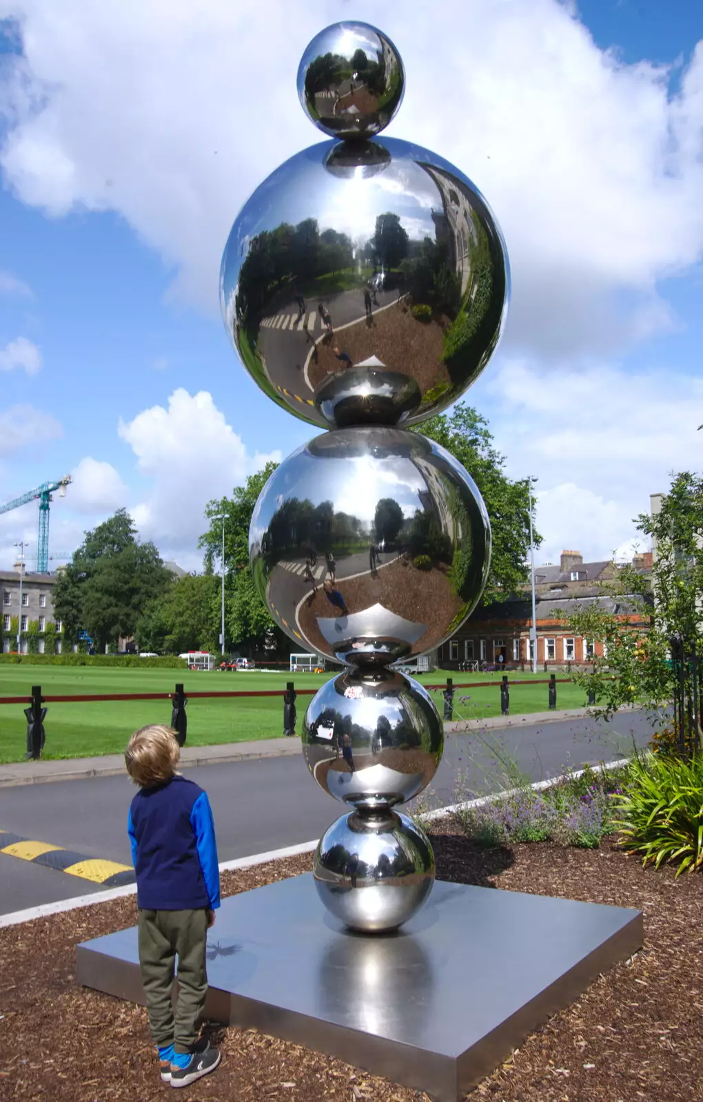 Harry stares up at a big steel ball sculpture, from Busking in Temple Bar, Dublin, Ireland - 12th August 2019