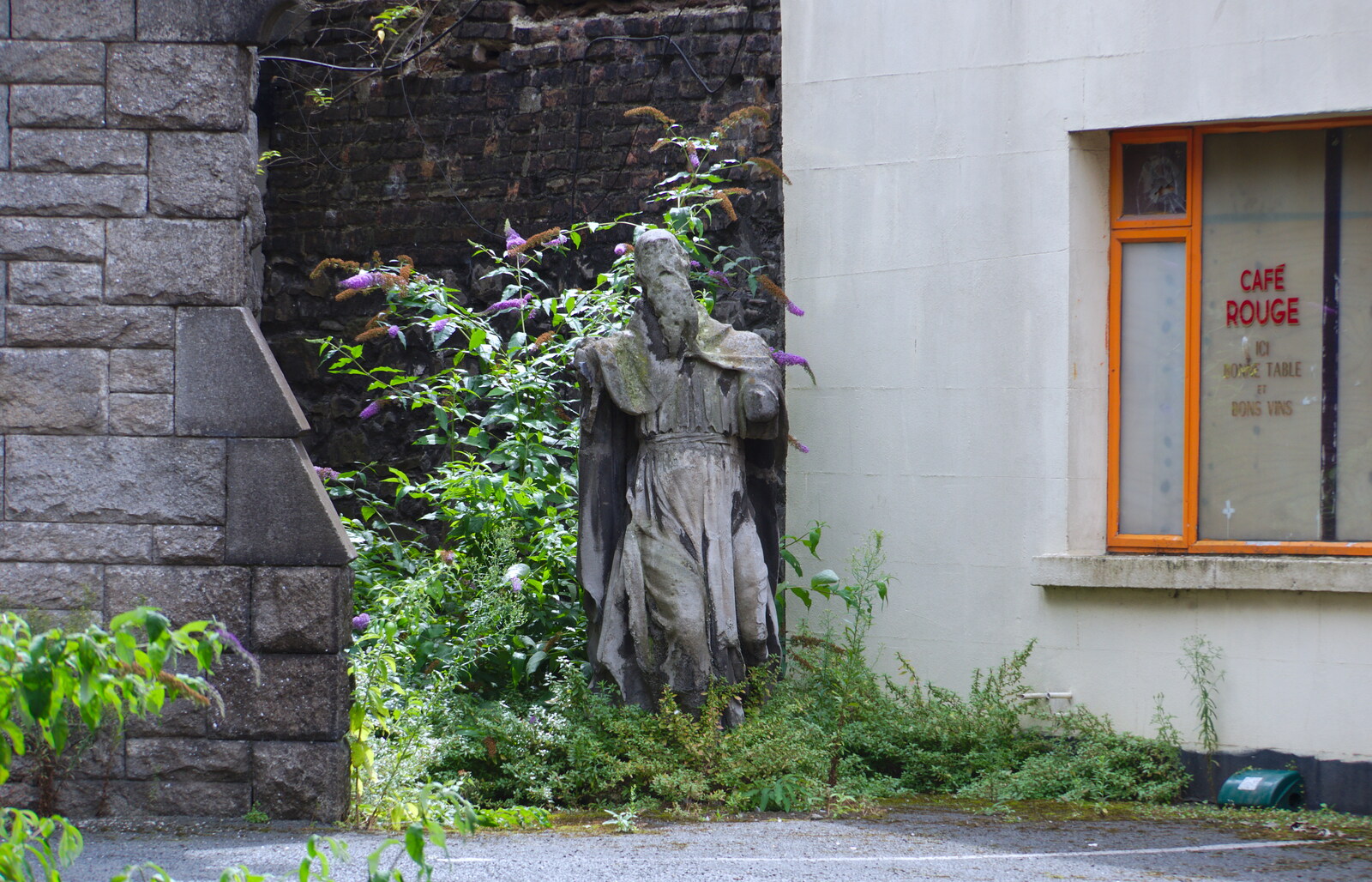 Some wrecked statue lurks in a car park from Busking in Temple Bar, Dublin, Ireland - 12th August 2019