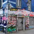 A graffiti-covered shop, Busking in Temple Bar, Dublin, Ireland - 12th August 2019