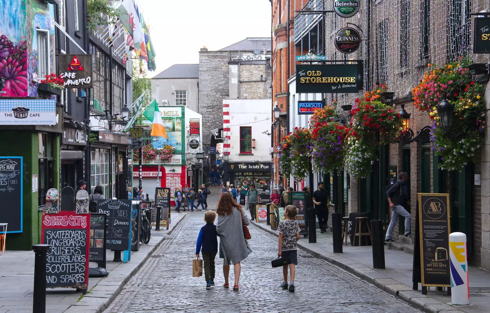 Isobel and the boys head into Temple Bar, from Busking in Temple Bar, Dublin, Ireland - 12th August 2019