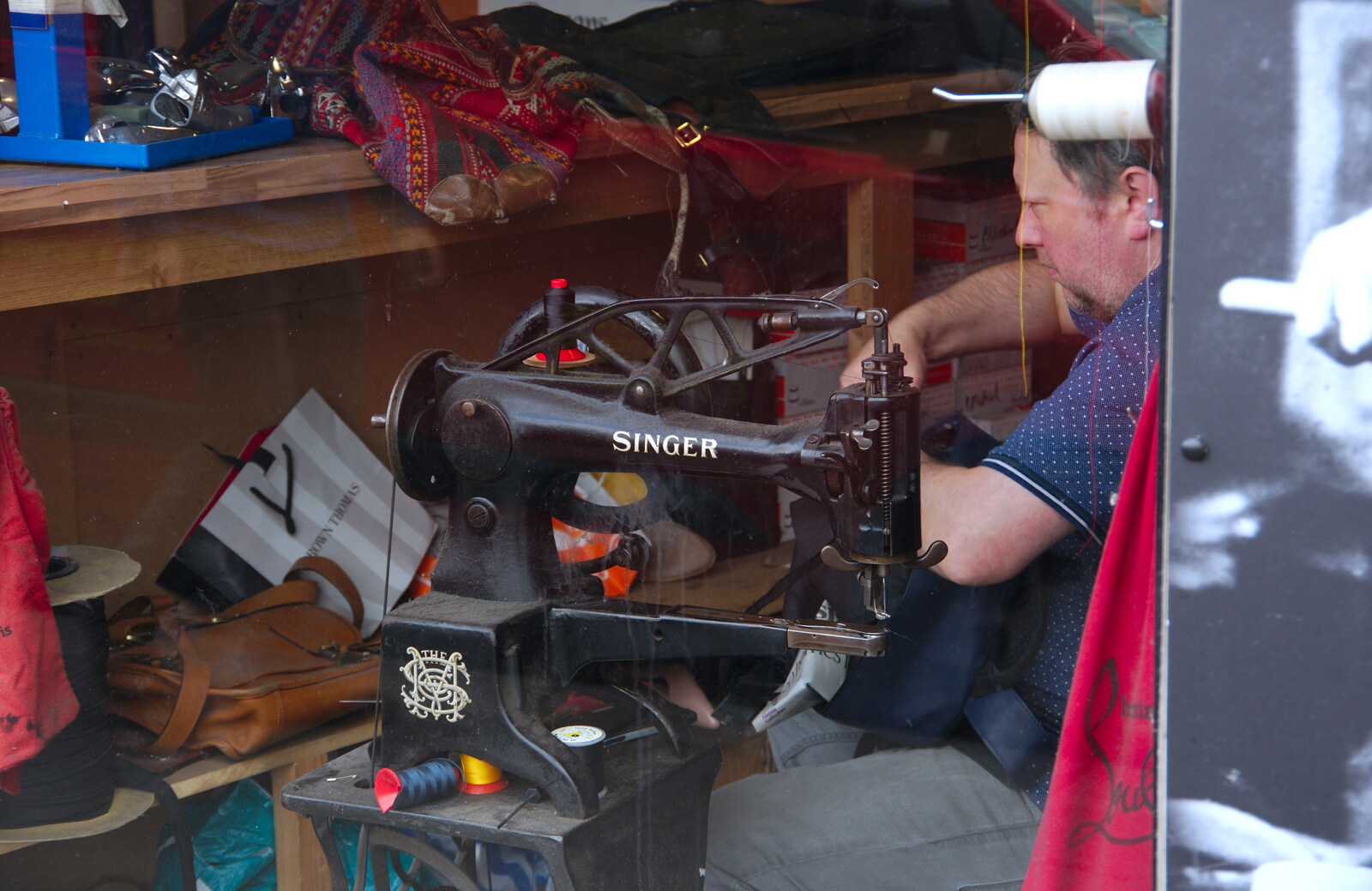 A repair shop with a Singer sewing machine from Busking in Temple Bar, Dublin, Ireland - 12th August 2019