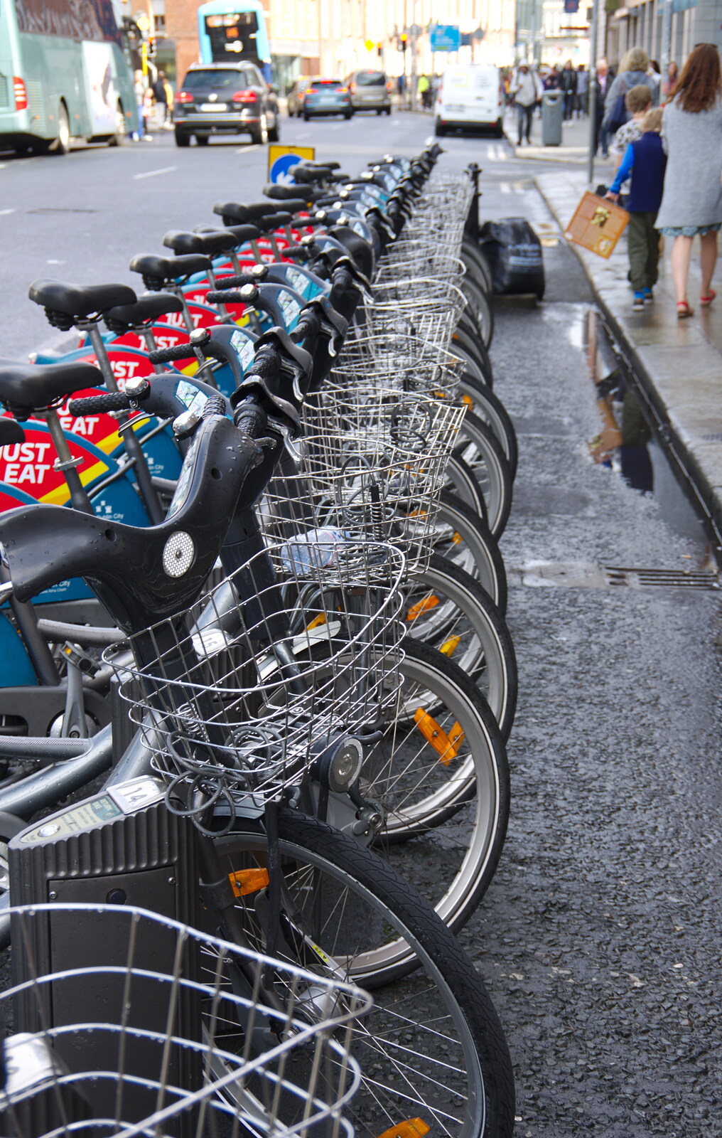 A row of Boris bikes from Busking in Temple Bar, Dublin, Ireland - 12th August 2019