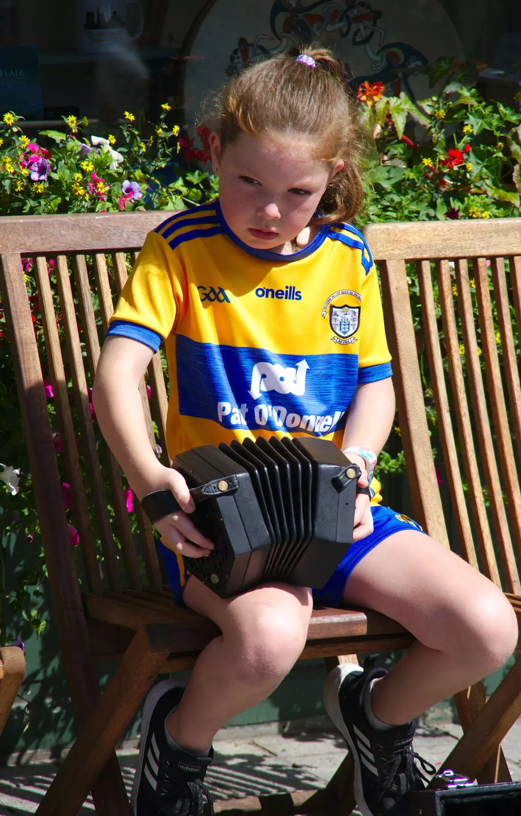 A serious-looking girl plays accordion, from The Fleadh Cheoil na hÉireann, Droichead Átha, Co. Louth, Ireland - 13th August 2019