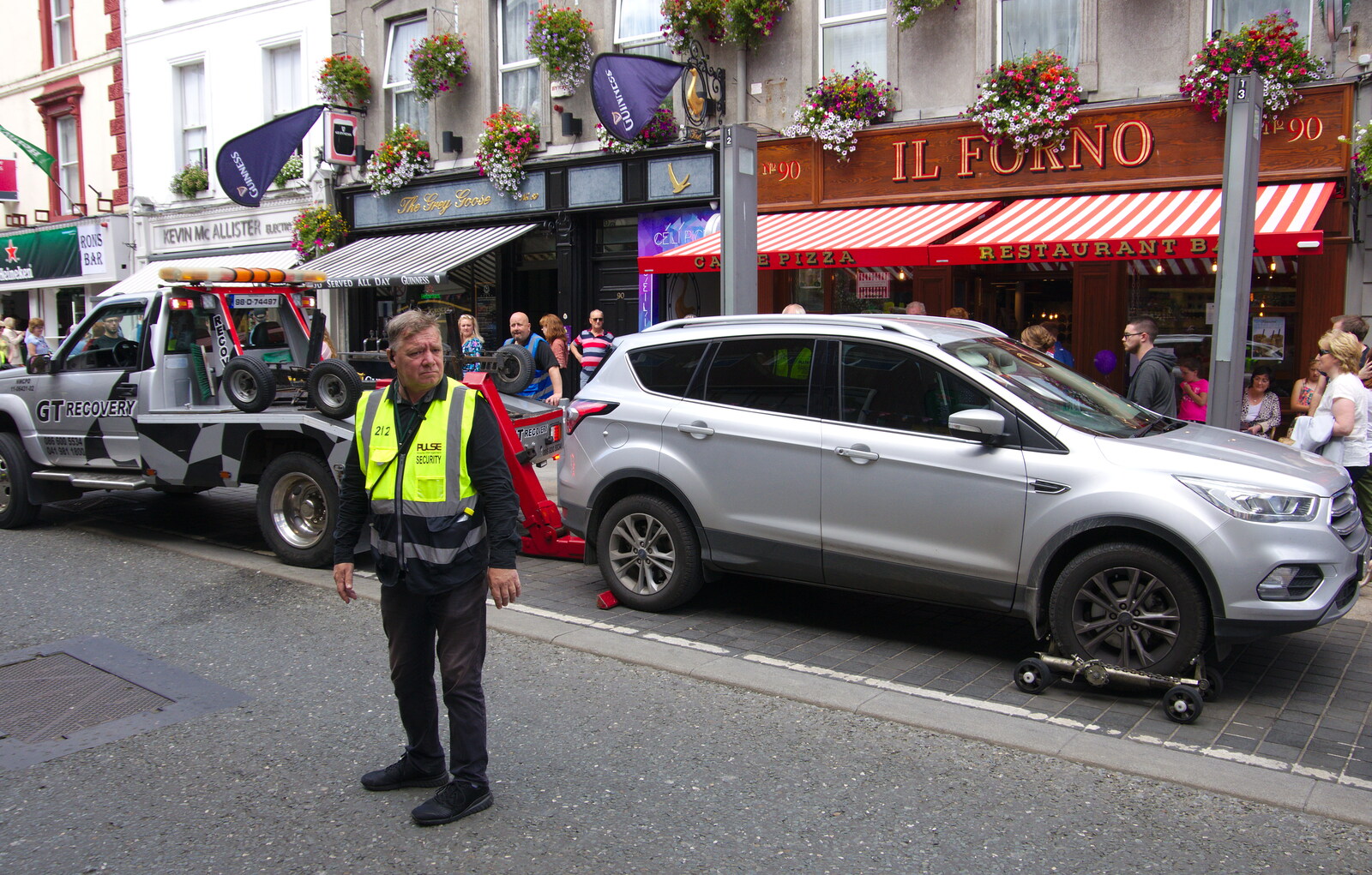 Some dude gets their car hauled off from The Fleadh Cheoil na hÉireann, Droichead Átha, Co. Louth, Ireland - 13th August 2019