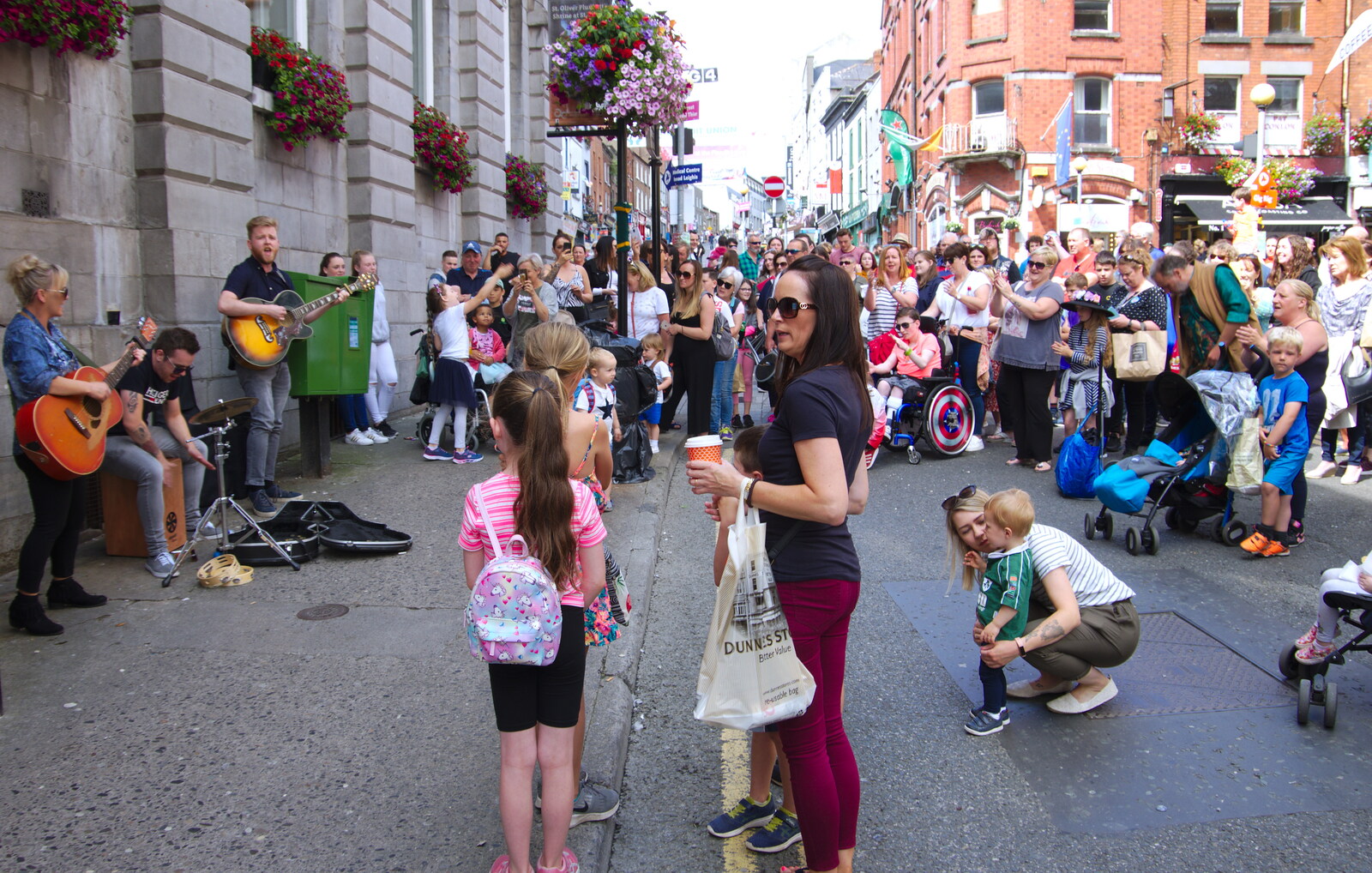 Big crowds on Shop Street from The Fleadh Cheoil na hÉireann, Droichead Átha, Co. Louth, Ireland - 13th August 2019
