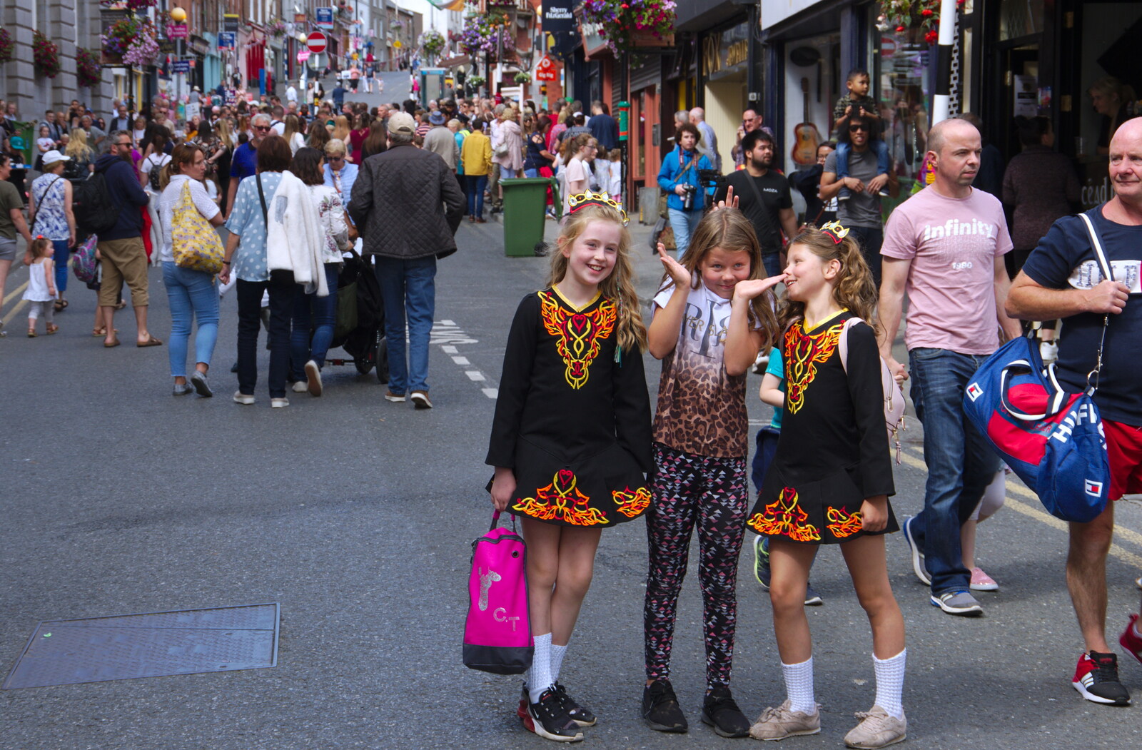 Some girls in traditional dress pose for a photo from The Fleadh Cheoil na hÉireann, Droichead Átha, Co. Louth, Ireland - 13th August 2019