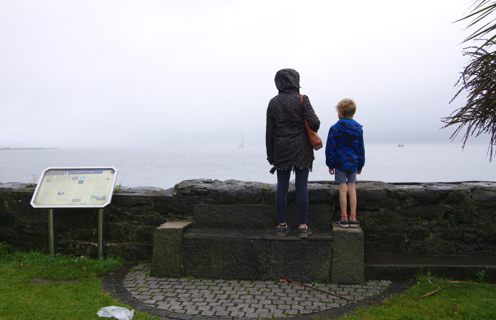 Isobel and Harry stare out over the lough from The Giant's Causeway, Bushmills, County Antrim, Northern Ireland - 14th August 2019