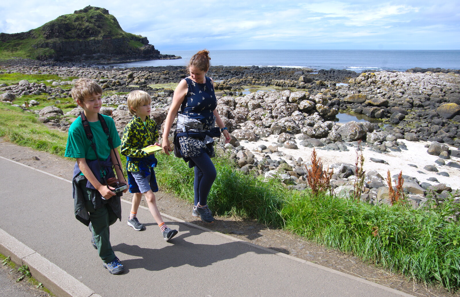 Fred, Harry and Isobel march along the road from The Giant's Causeway, Bushmills, County Antrim, Northern Ireland - 14th August 2019