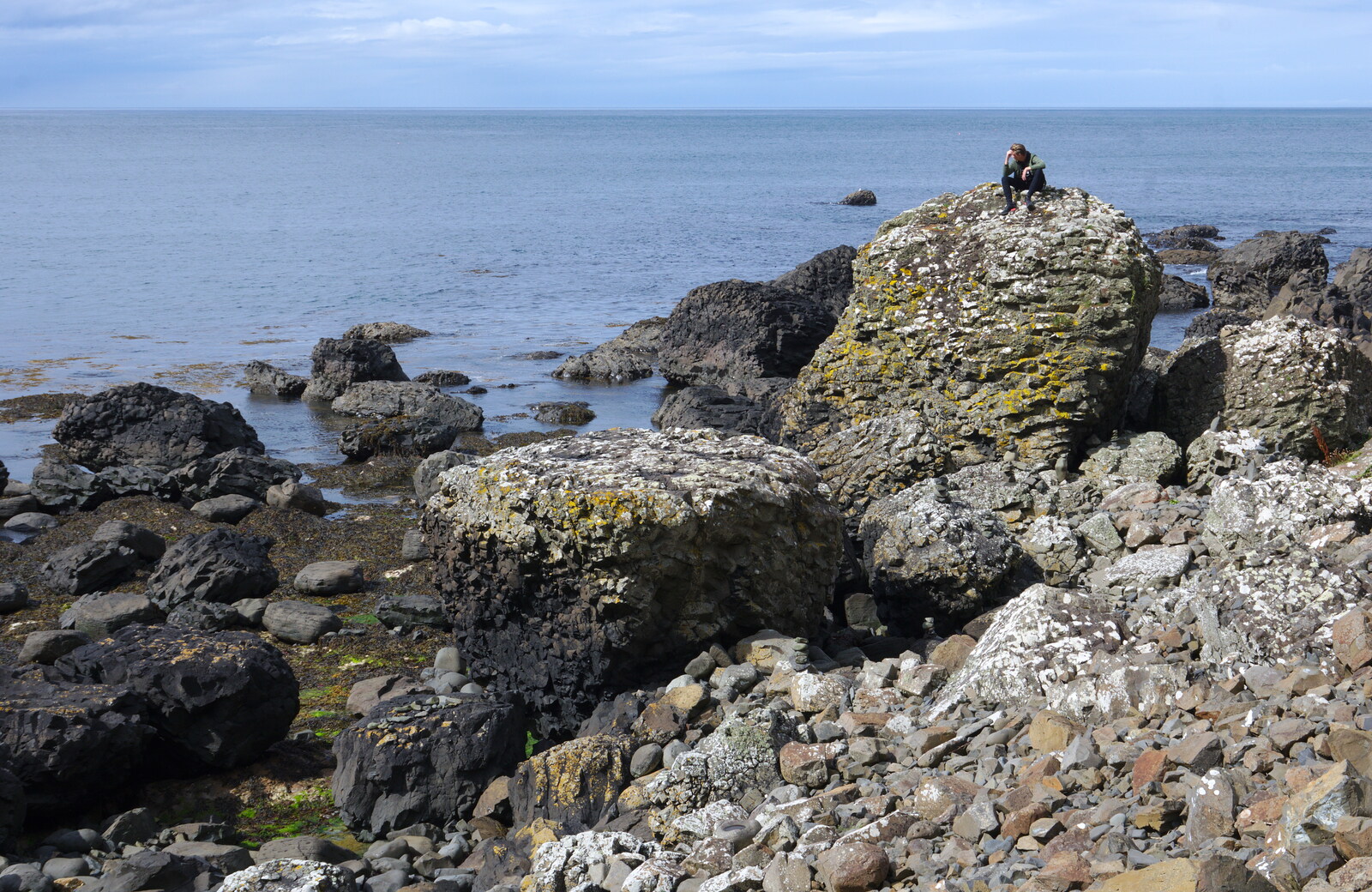 Some dude sits on a rock from The Giant's Causeway, Bushmills, County Antrim, Northern Ireland - 14th August 2019