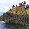 People swarm all over basalt columns, The Giant's Causeway, Bushmills, County Antrim, Northern Ireland - 14th August 2019