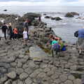 The boys look in a rock pool, The Giant's Causeway, Bushmills, County Antrim, Northern Ireland - 14th August 2019