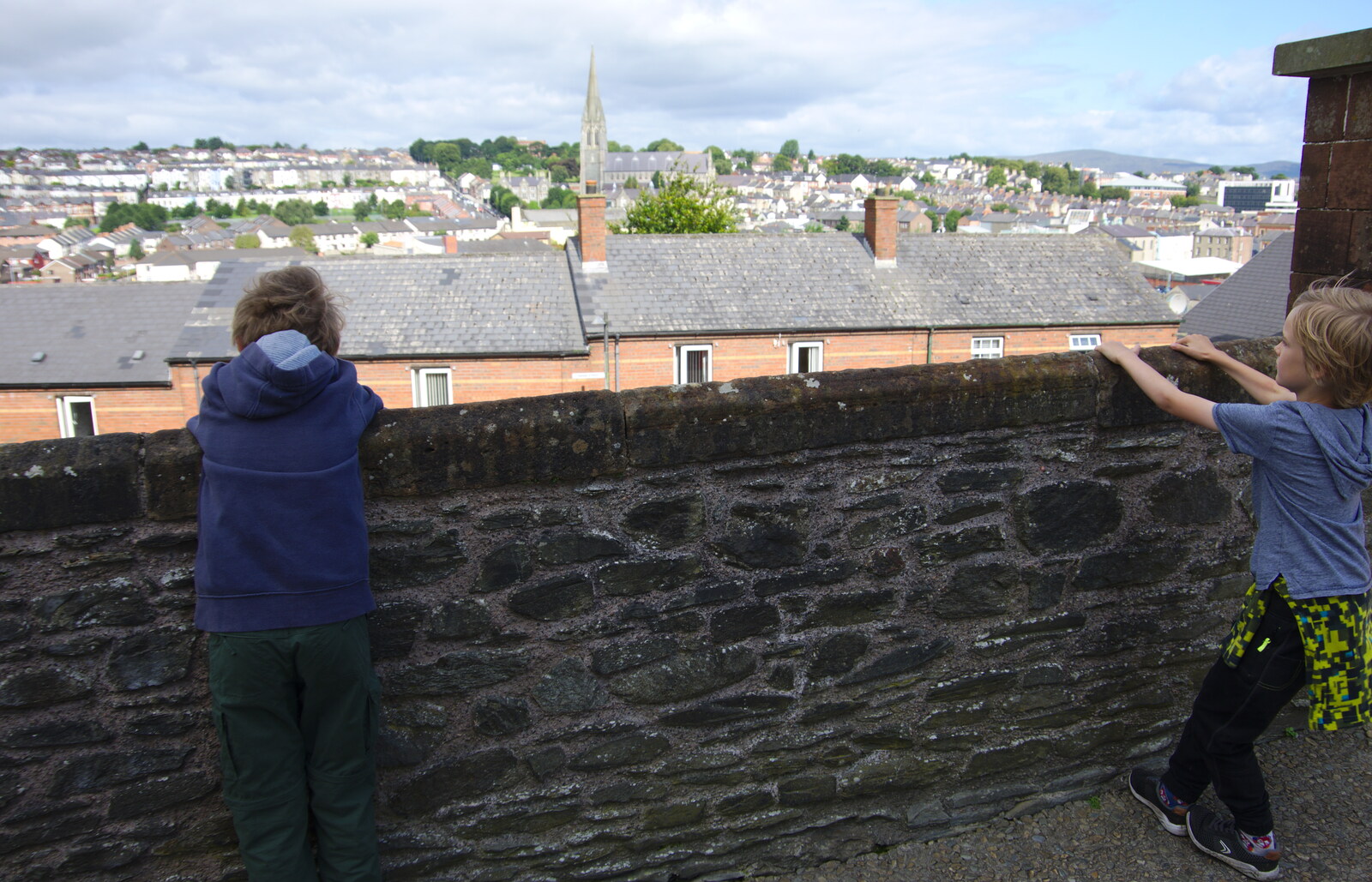 Fred and Harry look out over the walls from A Day in Derry, County Londonderry, Northern Ireland - 15th August 2019