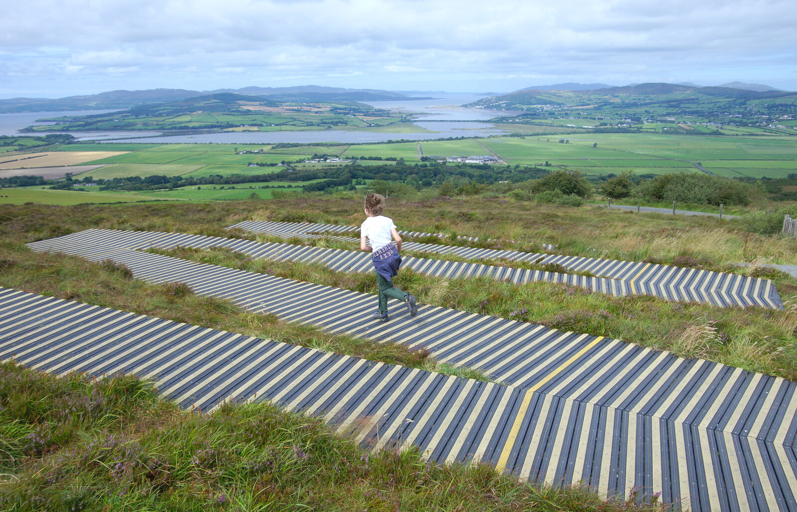 Fred runs down a boardwalk from A Day in Derry, County Londonderry, Northern Ireland - 15th August 2019