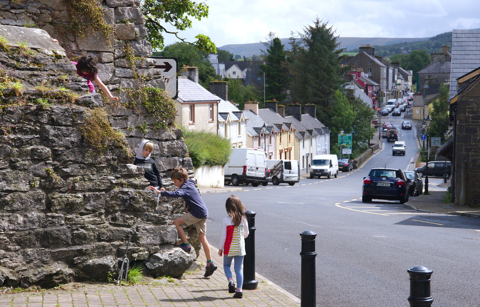 The children climb a wall on Castle Street from Open Mic Night, Bía Sláinte, Manorhamilton, Ireland - 17th August 2019