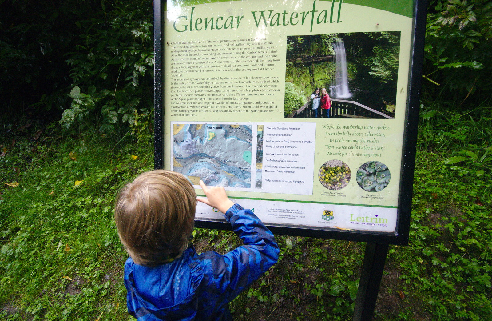 Harry inspects a sign from Glencar Waterfall and Parke's Castle, Kilmore, Leitrim, Ireland - 18th August 2019