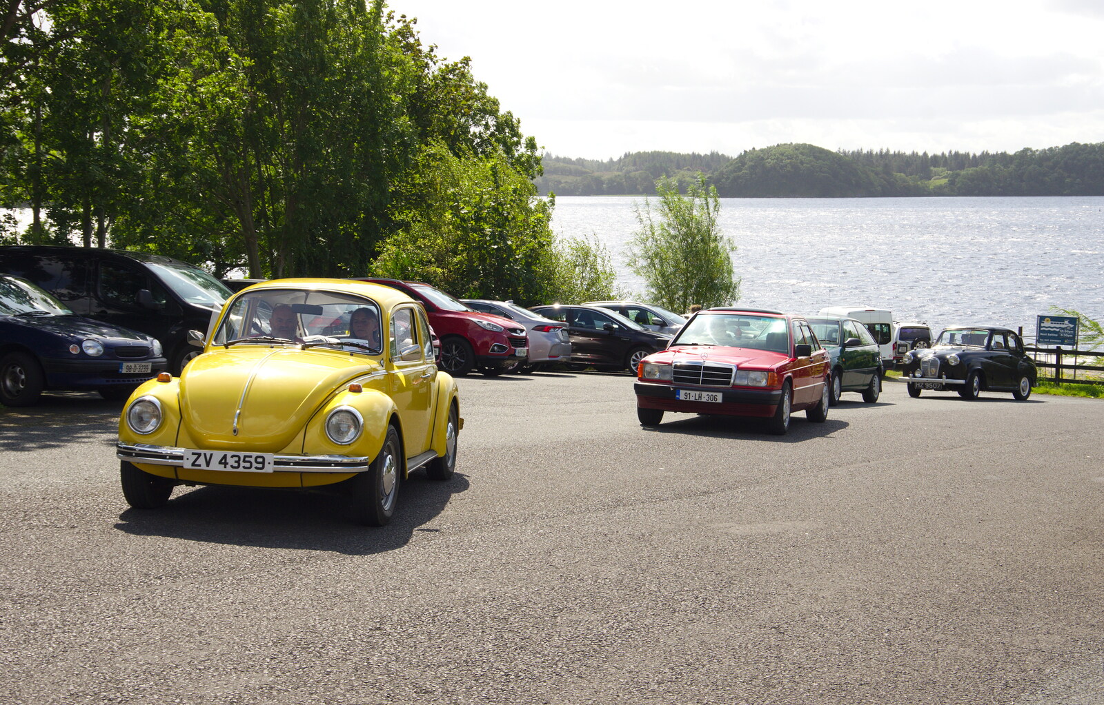 A Beetle, old Merc and a Morris leave the car park from Glencar Waterfall and Parke's Castle, Kilmore, Leitrim, Ireland - 18th August 2019