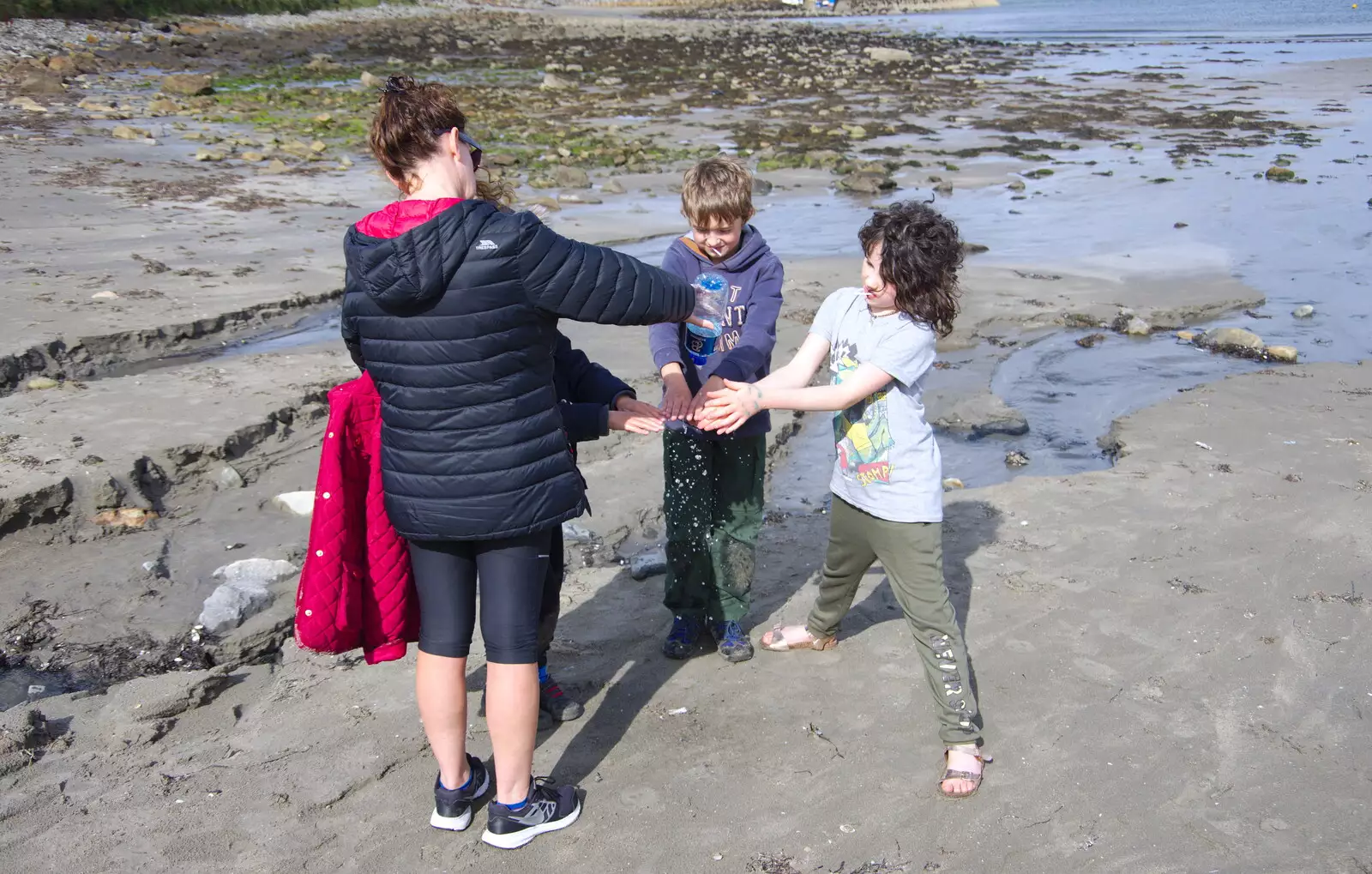 Evelyn rinses off some hands, from Mullaghmore Beach and Marble Arch Caves, Sligo and Fermanagh, Ireland - 19th August 2019