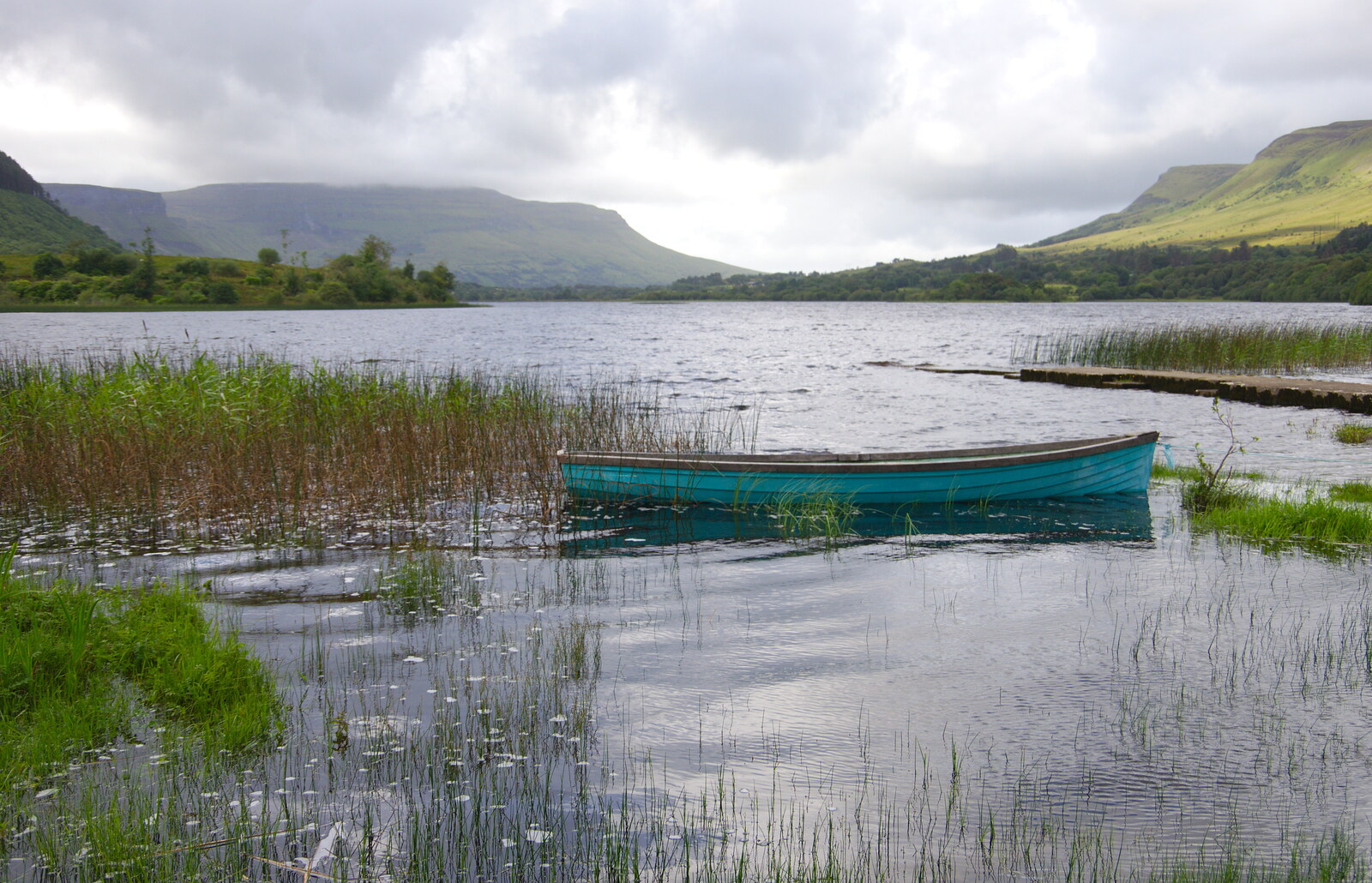 The silent sorrow of empty boats on Lough Glenade from Mullaghmore Beach and Marble Arch Caves, Sligo and Fermanagh, Ireland - 19th August 2019