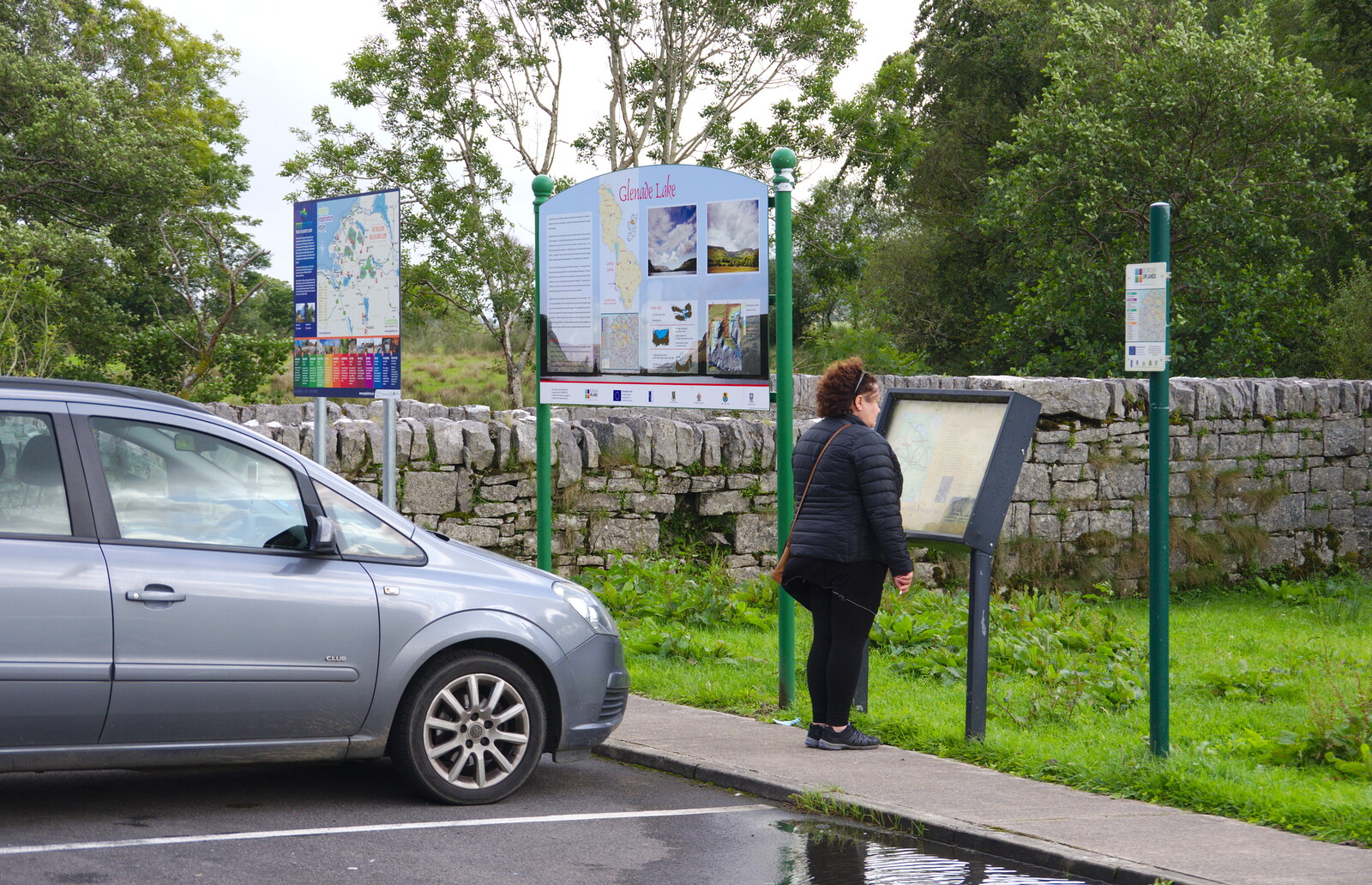 Louise reads a sign from Mullaghmore Beach and Marble Arch Caves, Sligo and Fermanagh, Ireland - 19th August 2019