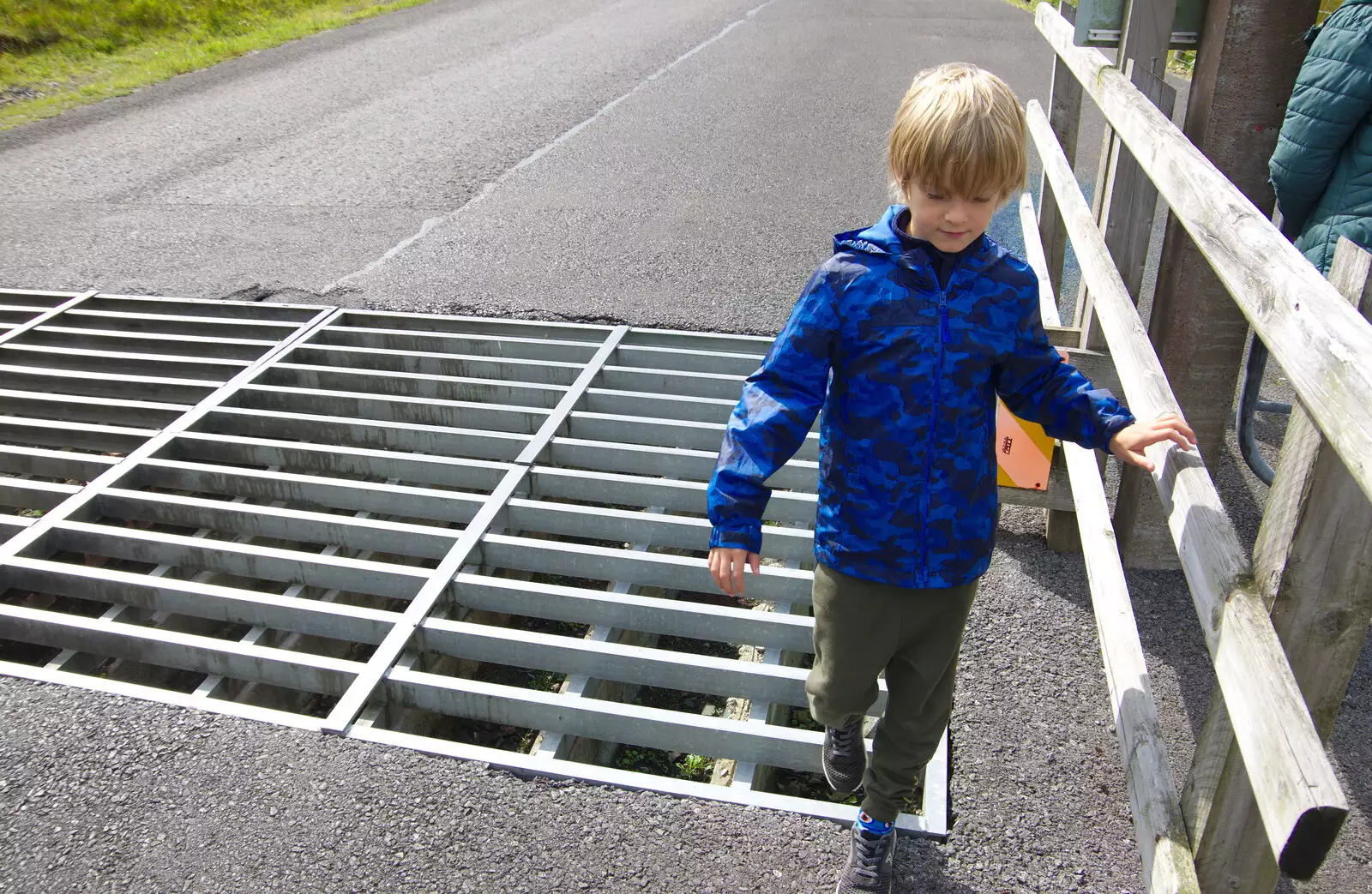 Harry goes the awkward way across a cattle grid, from Mullaghmore Beach and Marble Arch Caves, Sligo and Fermanagh, Ireland - 19th August 2019