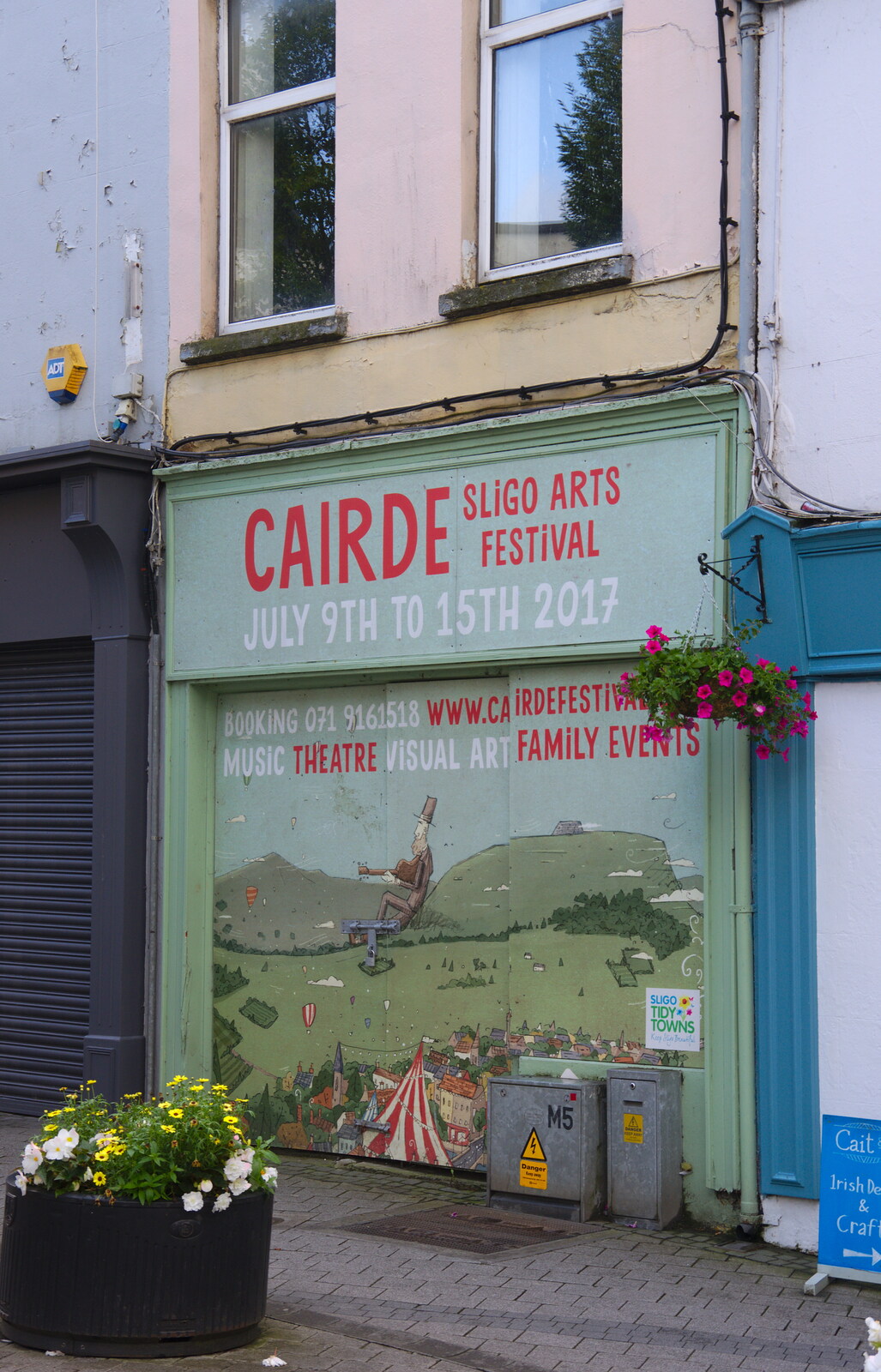 A boarded up shop is an advert for an arts festival from Florence Court and a Postcard from Sligo, Fermanagh and Sligo, Ireland - 21st August 2019